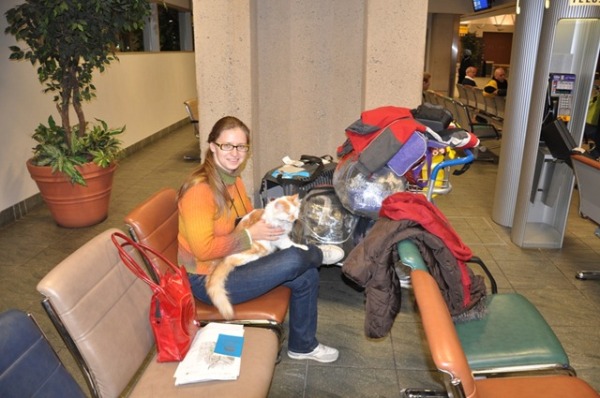 Olena and our cat Rudy at the airport